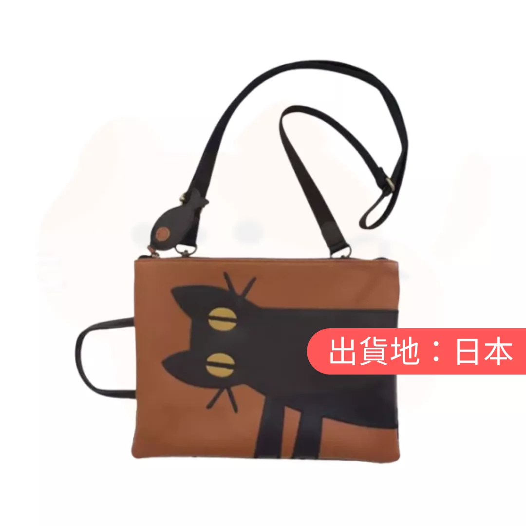凝視貓。單肩包