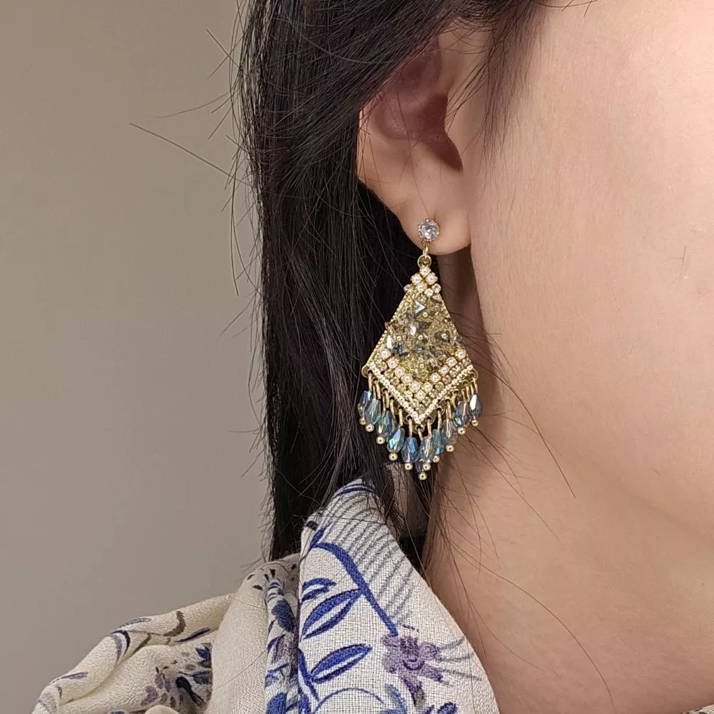 《晨光羽跡》金色羽葉垂墜耳環