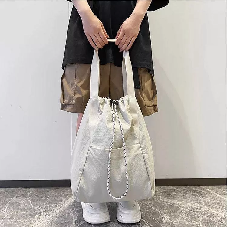 防潑水輕便抽繩多用途雙肩包大容量水桶包